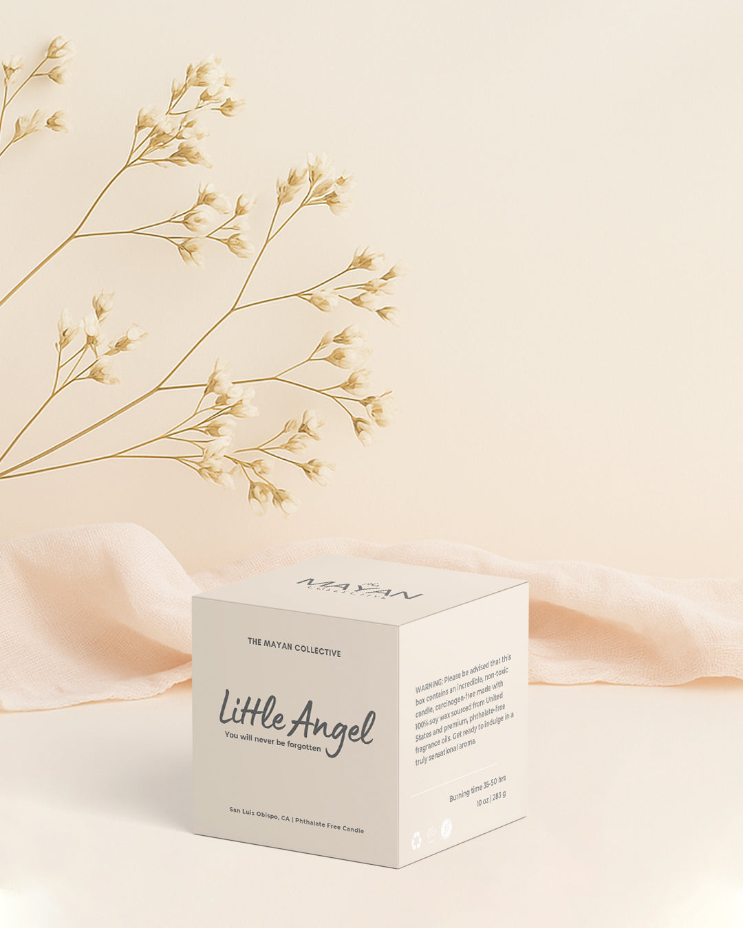 Product box labeled 'Little Angel' with dried flowers on a soft beige background