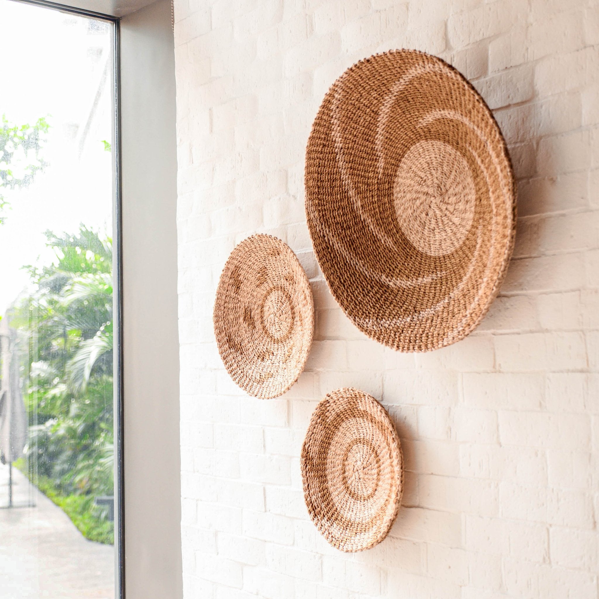 LIKHÂ Natural + Brown Wall Baskets, Medium - Round Wall Baskets | LIKHÂ LIKHÂ | Heirloom Boulevard