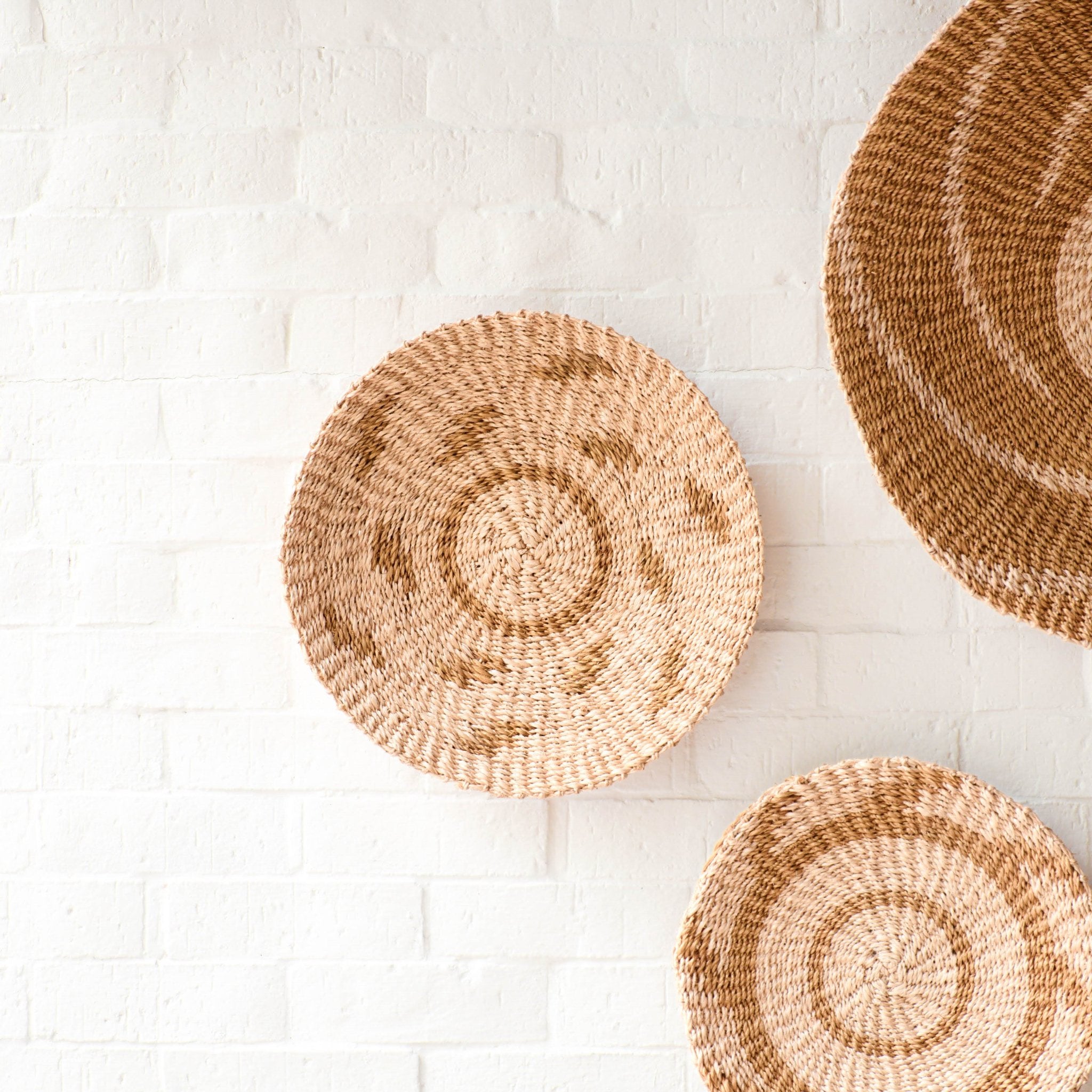 LIKHÂ Natural + Brown Wall Baskets, Medium - Round Wall Baskets | LIKHÂ LIKHÂ | Heirloom Boulevard