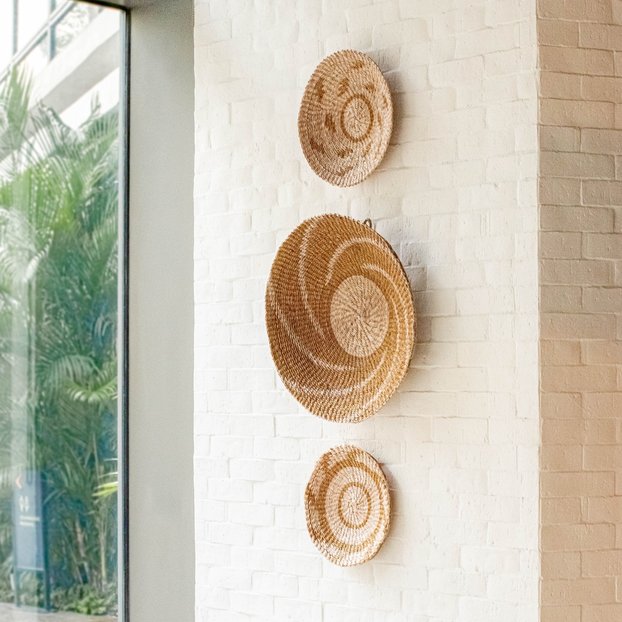 LIKHÂ Natural + Brown Wall Baskets, Small - Round Wall Baskets | LIKHÂ LIKHÂ | Heirloom Boulevard